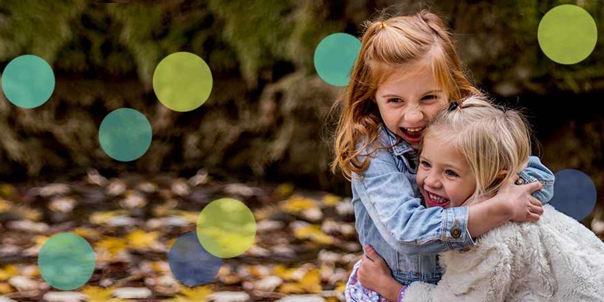 sisters playing and smiling