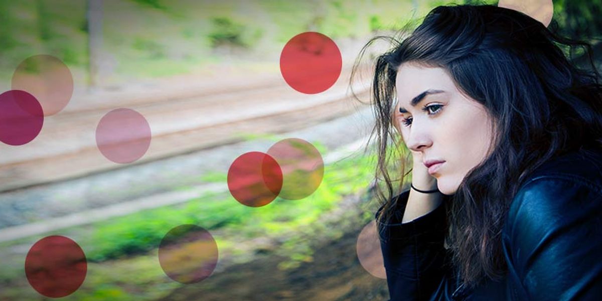 woman upset looking out the window