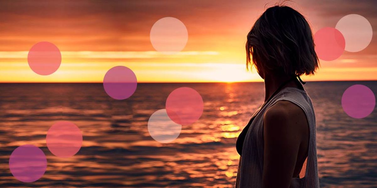 woman looking out at the water