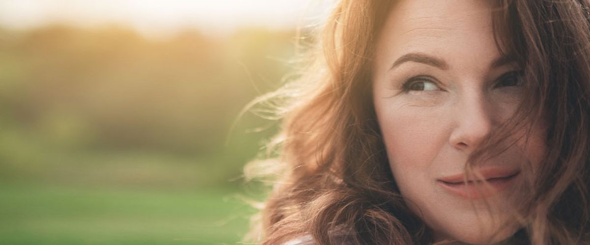 woman looking pensively