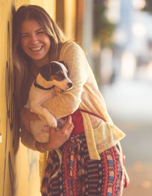 happy girl hugging her dog
