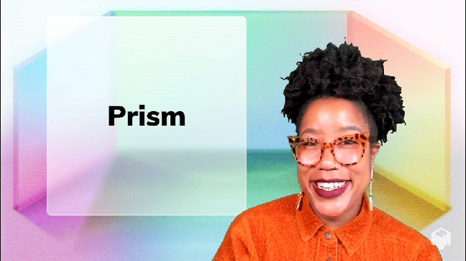 Person with orange shirt and glasses in front of colorful prism
