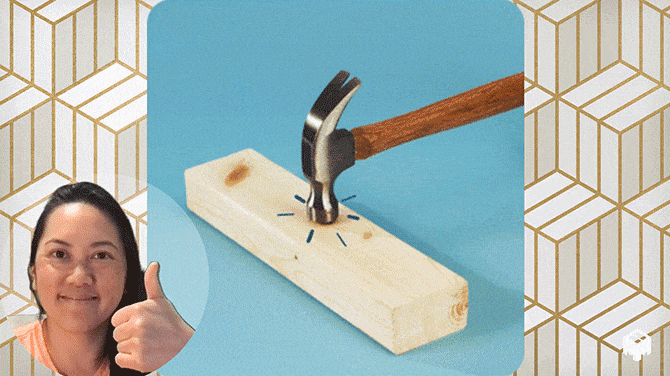 Nail being hammered into a piece of wood, woman with thumbs up in the corner