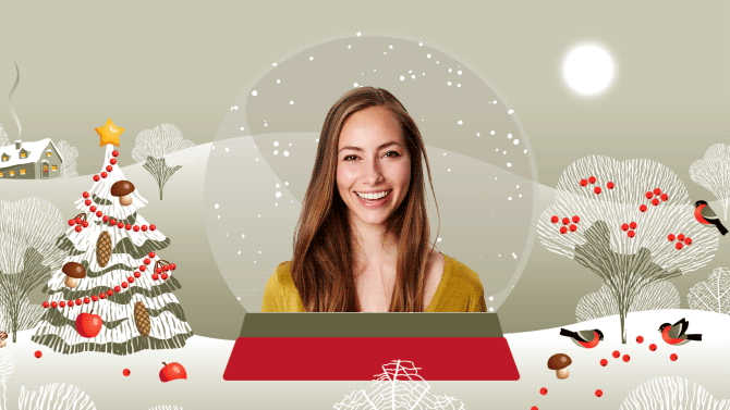 Woman centered in a snow globe on a Christmas themed background with brown hair and a mustard shirt