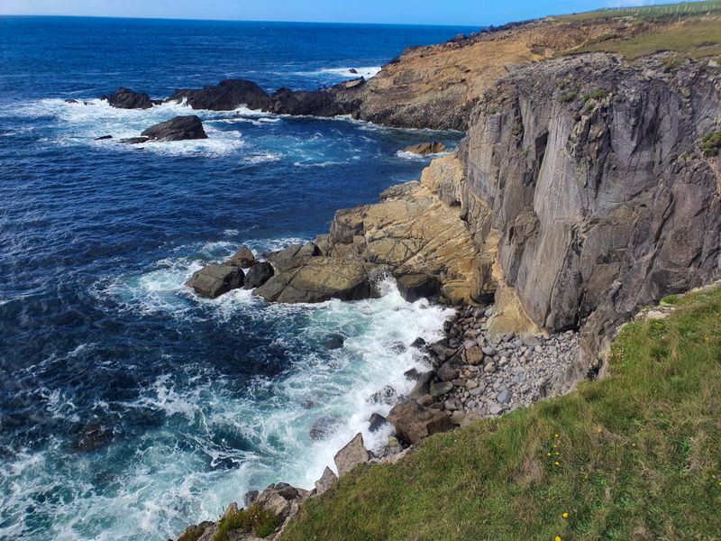 Atlantic waves breaking against rocky cliffs on the Wild Atlantic Way