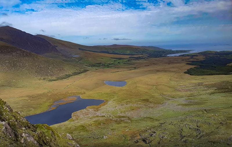 View from the Conor Pass over glacial lakes toward the north Dingle coast