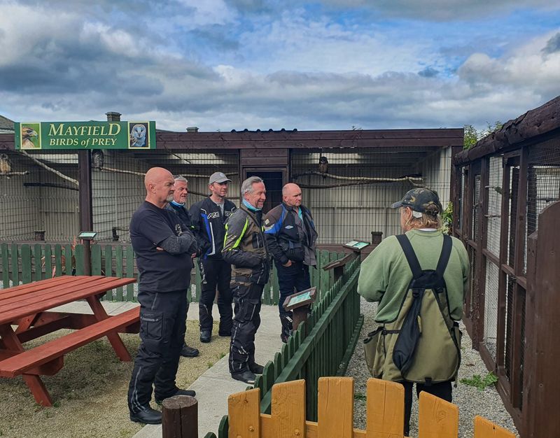 Motorcyclists listening to a falconer at the Mayfield Birds of Prey centre