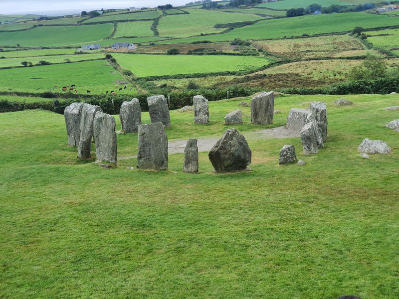 Drombeg stone circle standing in a green field above the West Cork coastline
