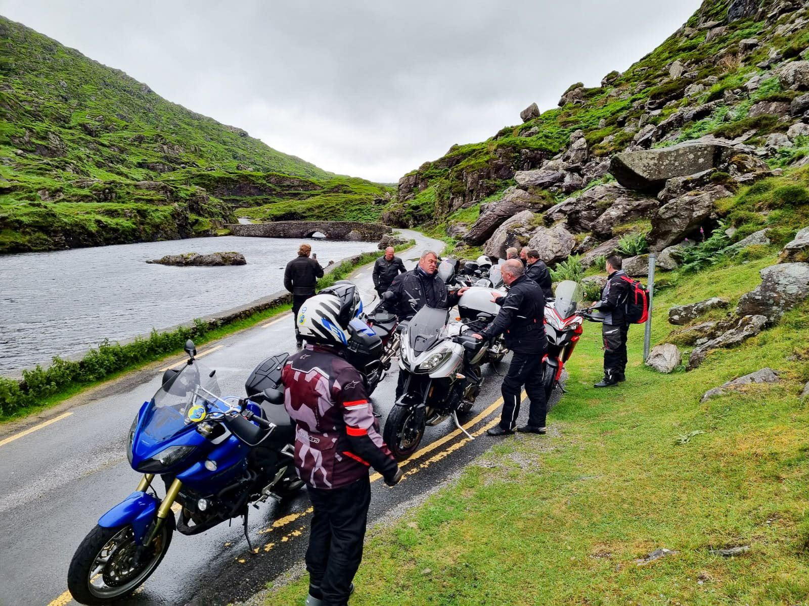 Riders paused by the Wishing Bridge in the Gap of Dunloe