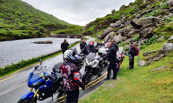 Riders paused by the Wishing Bridge in the Gap of Dunloe