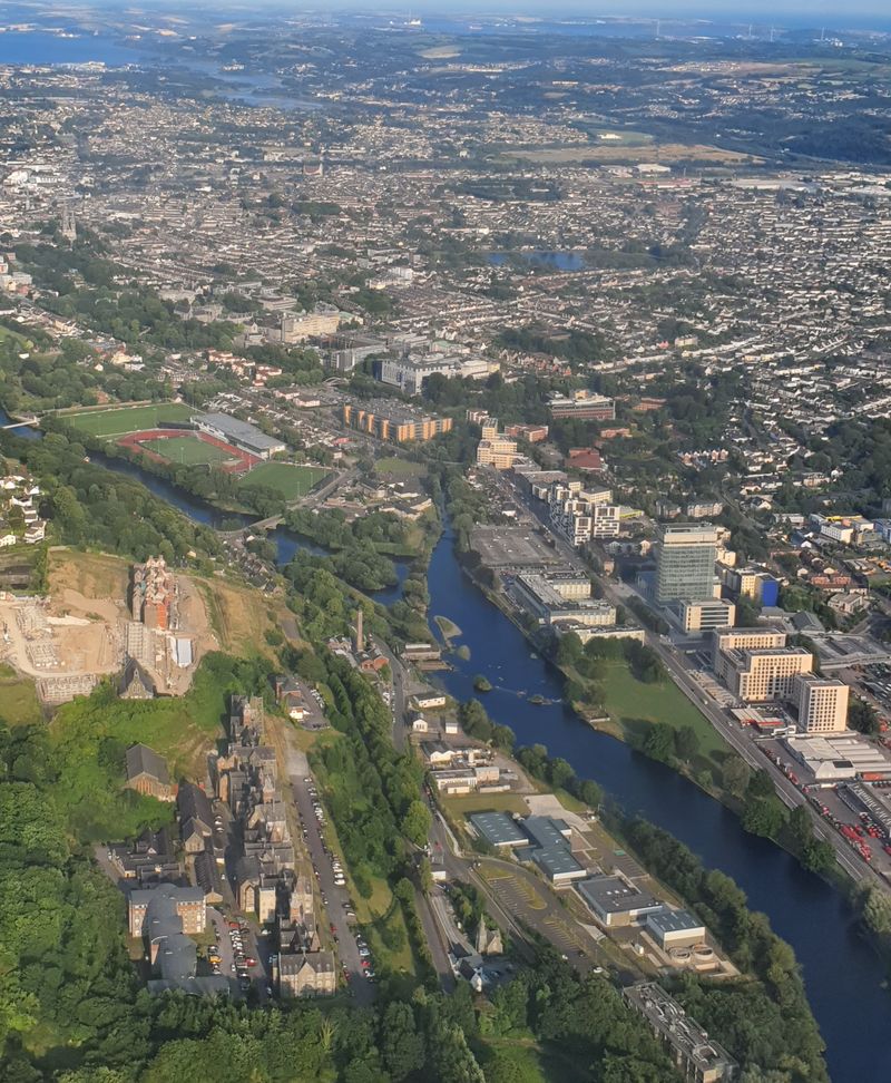 Aerial view of the River Lee winding through Cork city in evening light