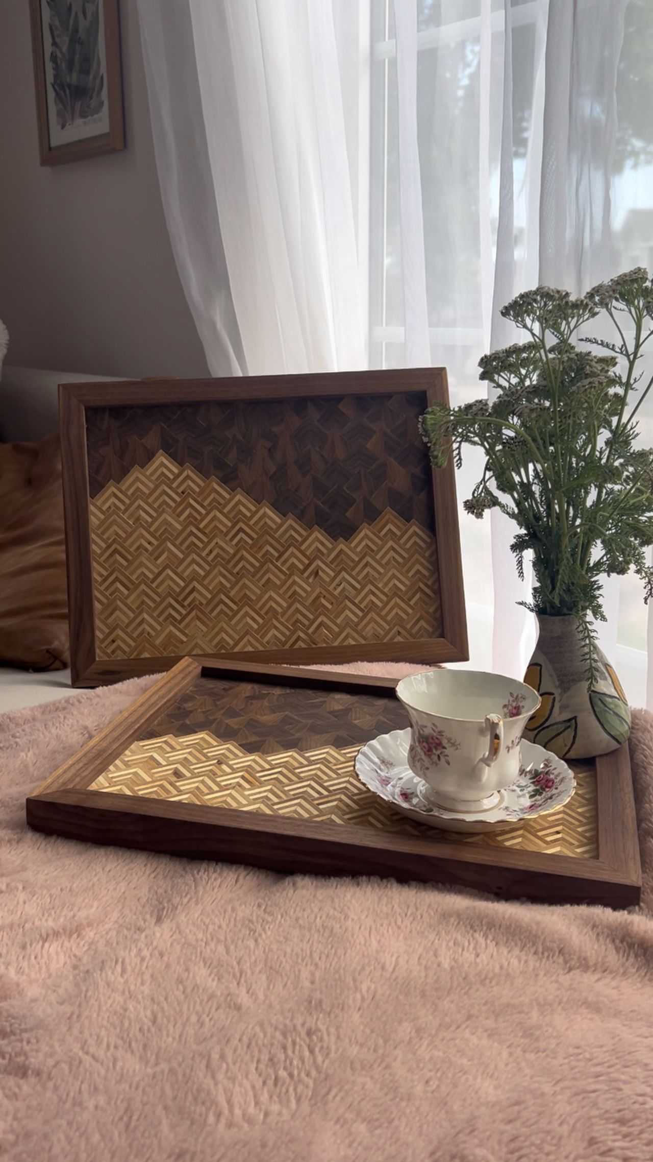 Pair of walnut-framed serving trays with a two-tone herringbone mountain pattern