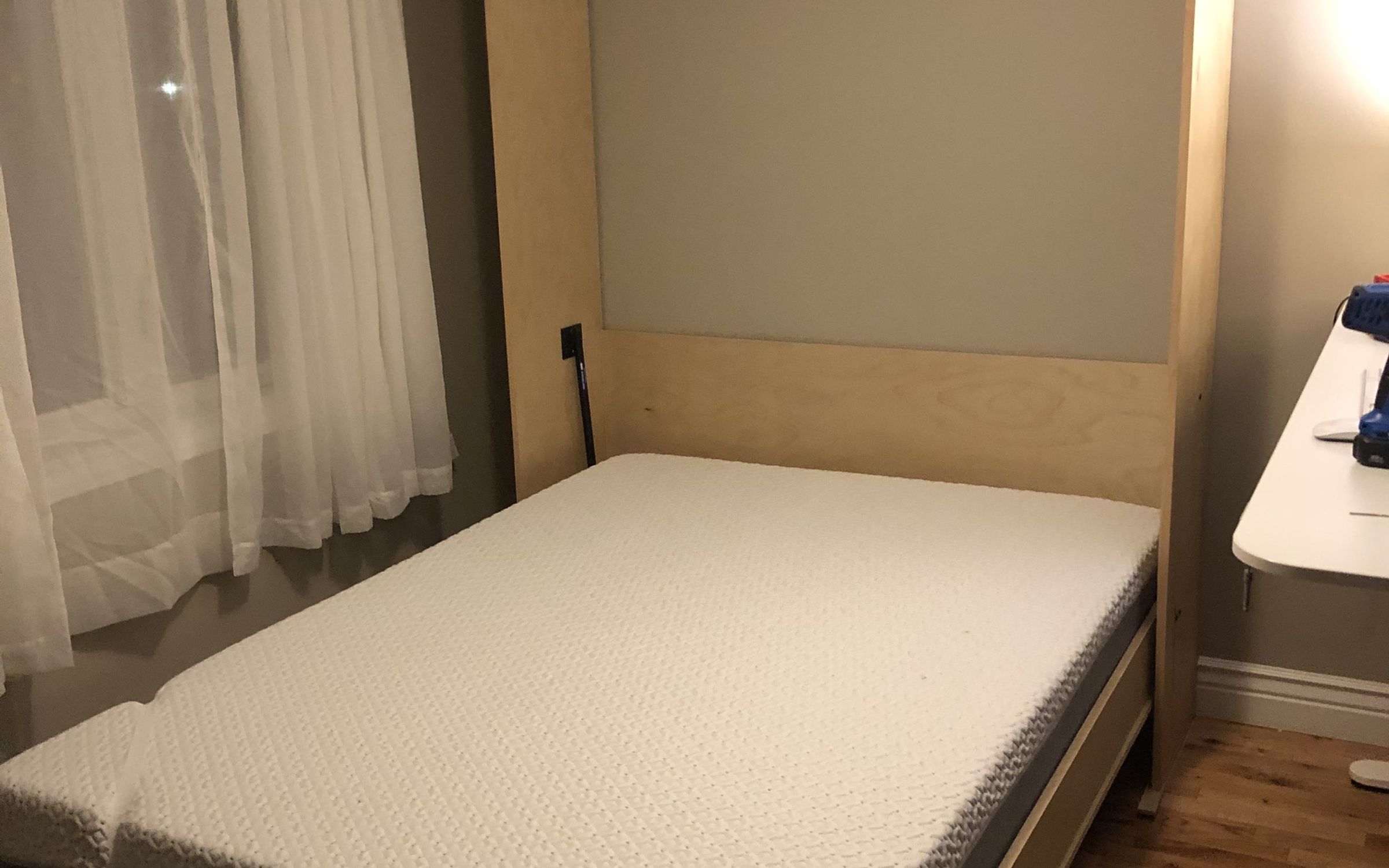 Birch Murphy bed folded down with mattress