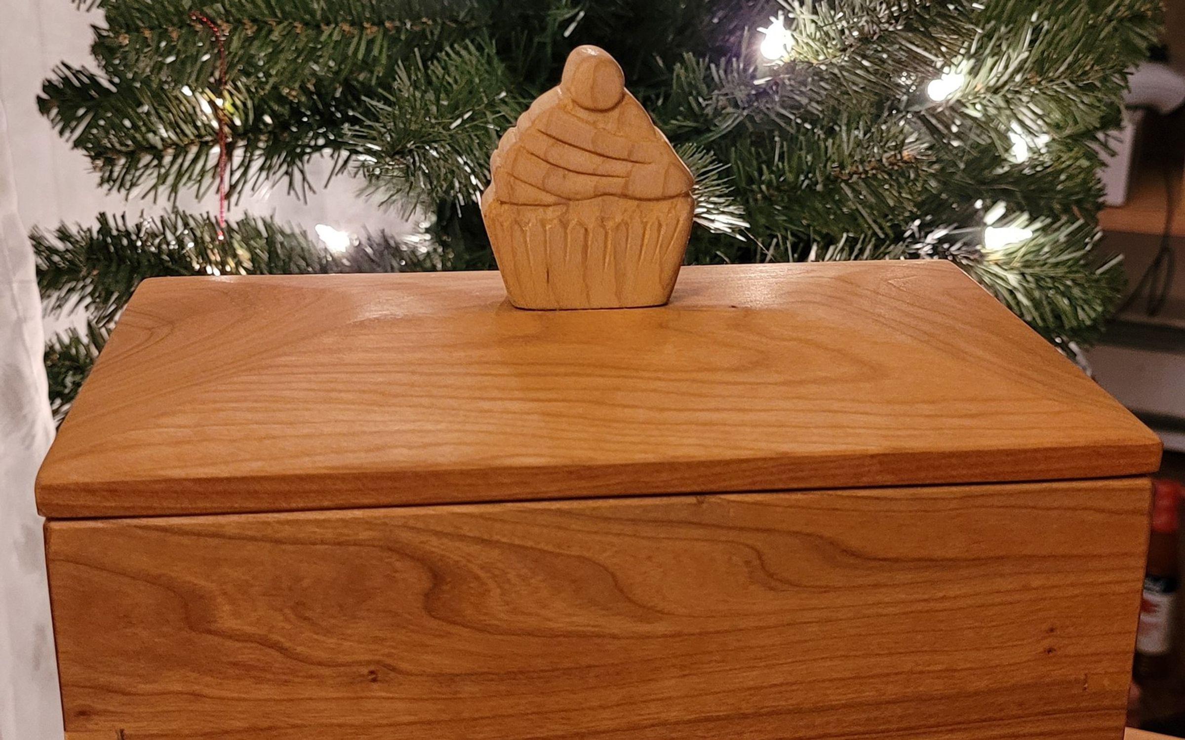 Cherry recipe box with a carved cupcake handle on the lid