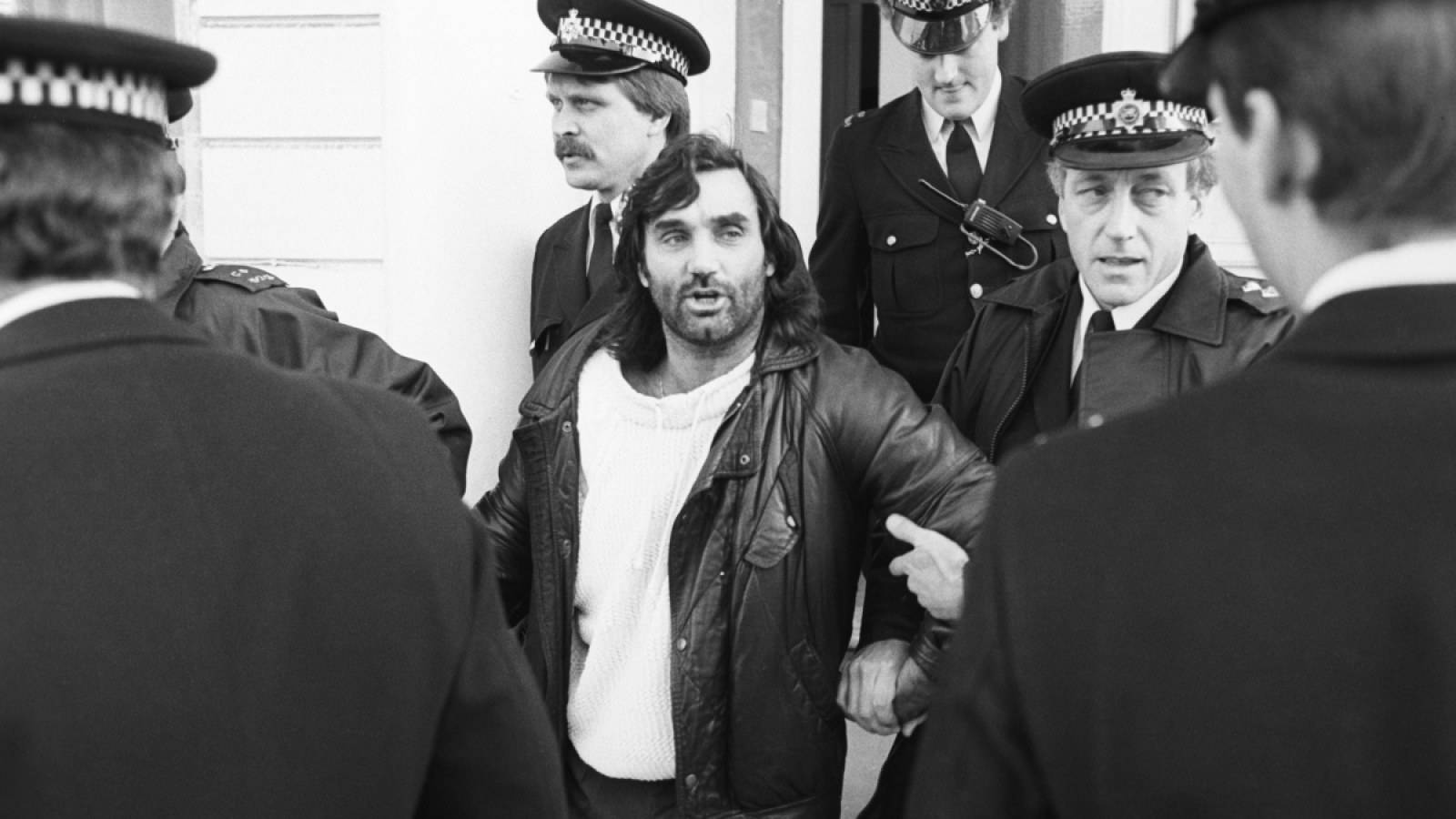 George Best being taken away by police after being arrested on drink-driving charges on 4 November, 1984
