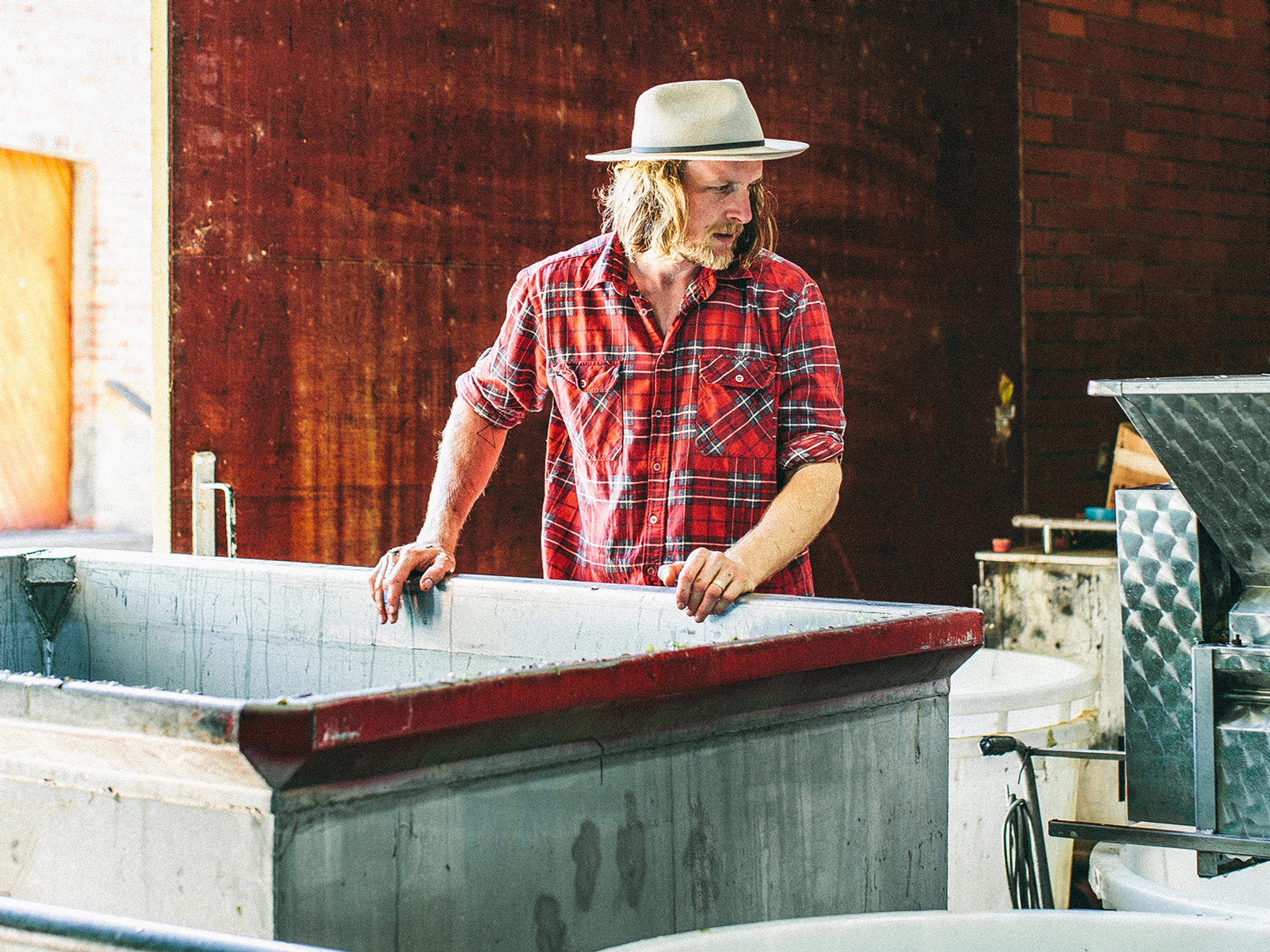 Matt hard at work looking over a vat.