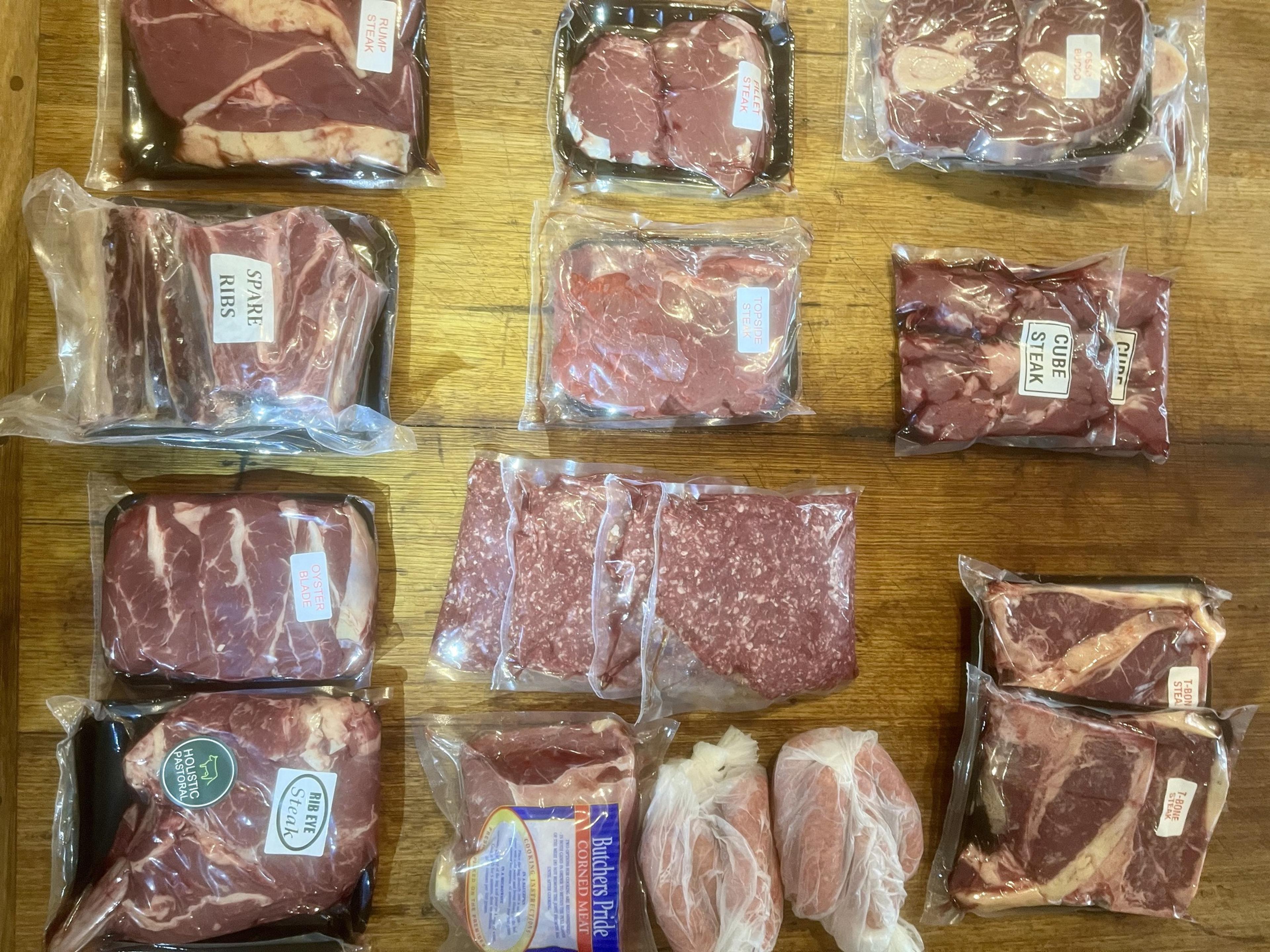 Packaged meat laid out on a table.