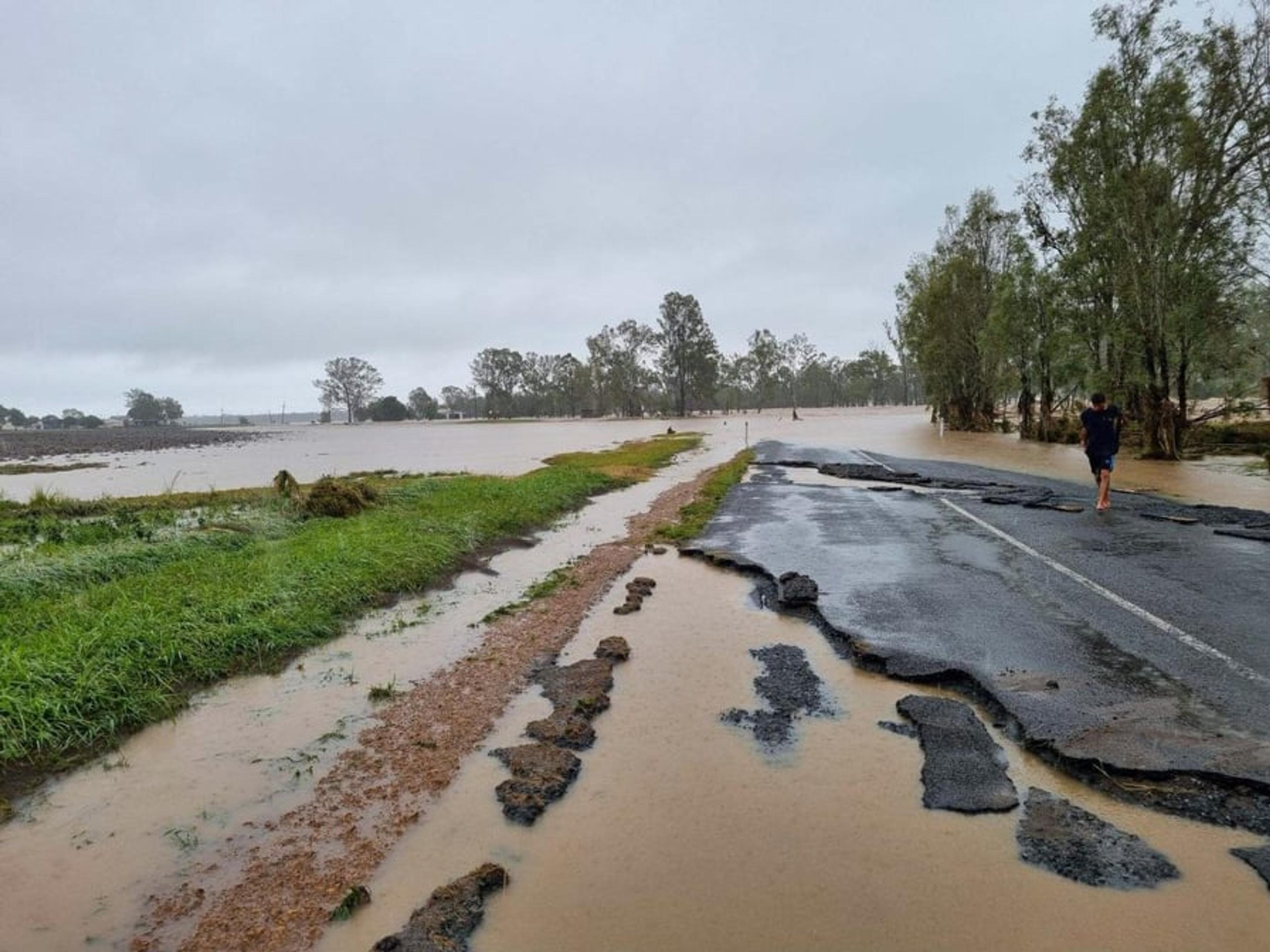 A flood ravaged road and surrounds.