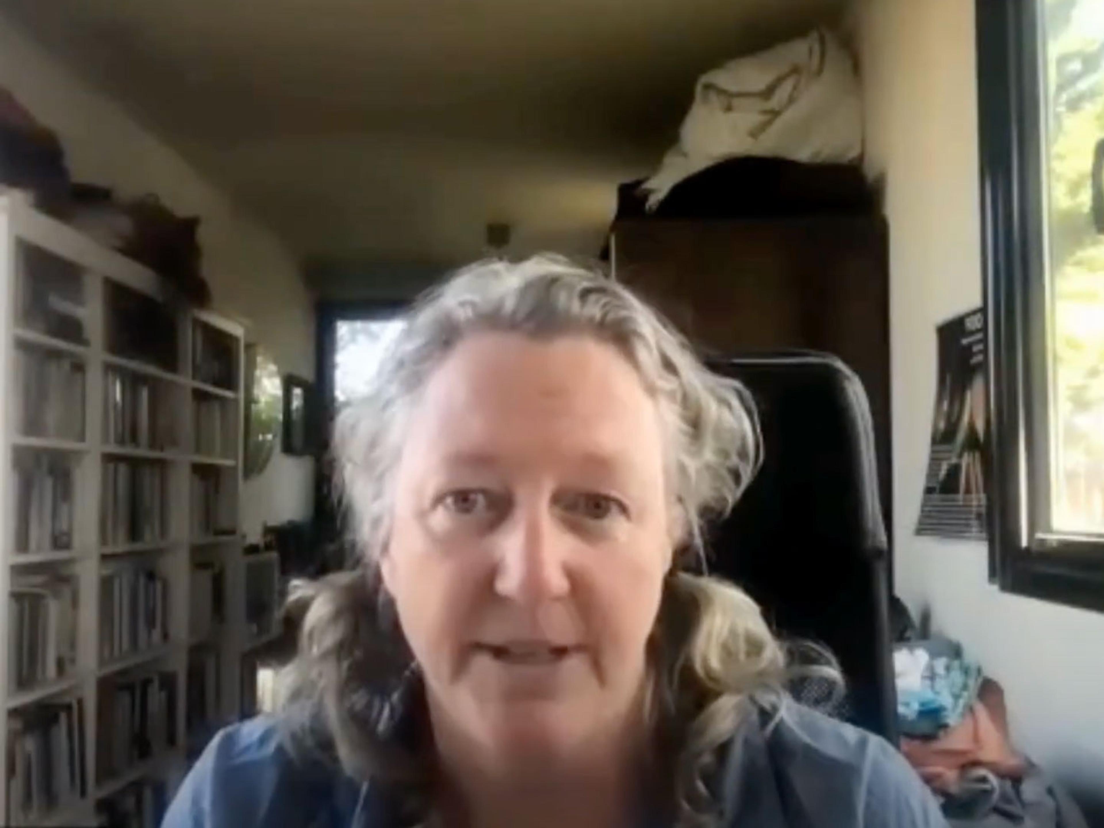 A woman presenting on a Zoom call.