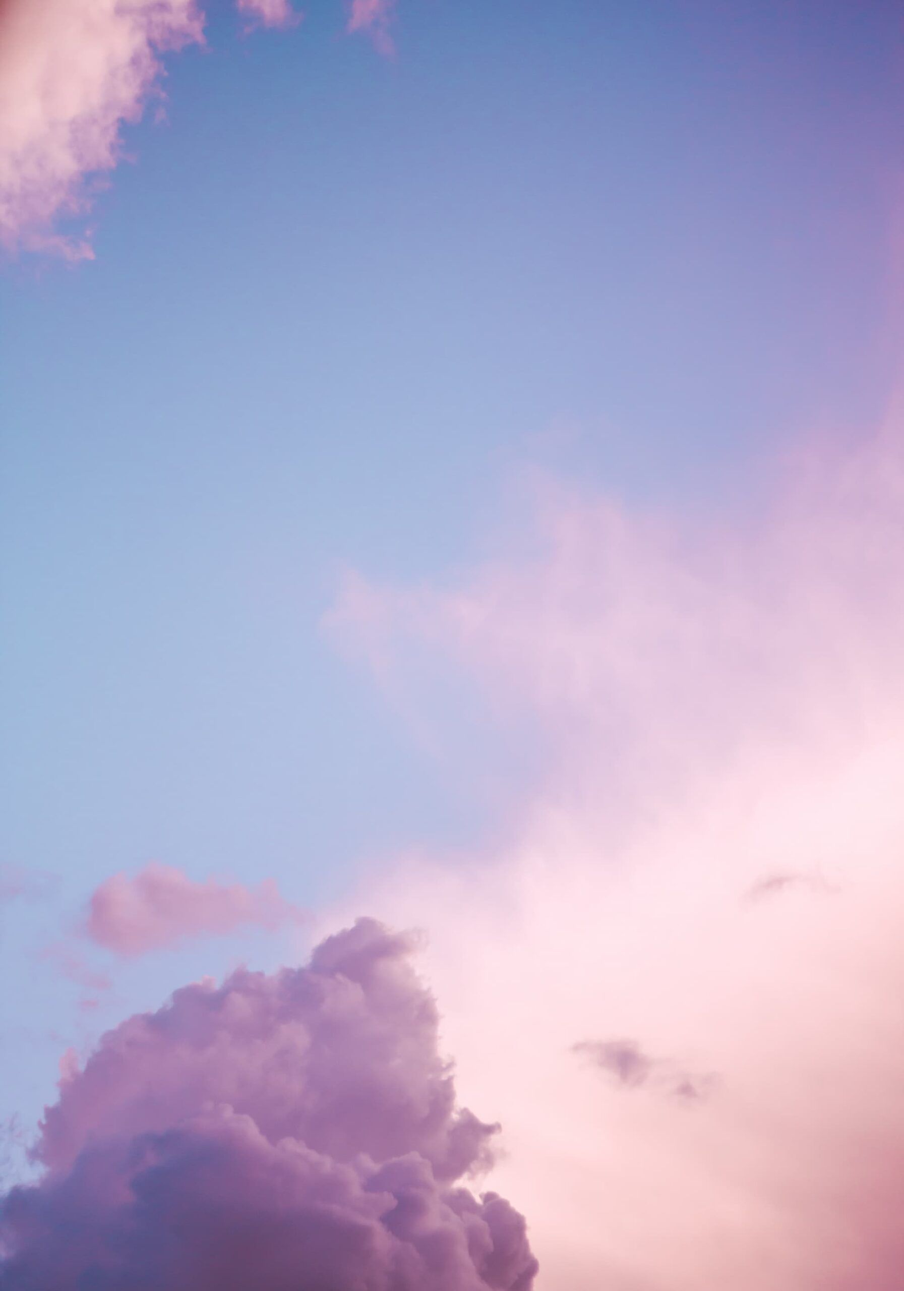 A clouded sky in soft blue and pink colors. 
