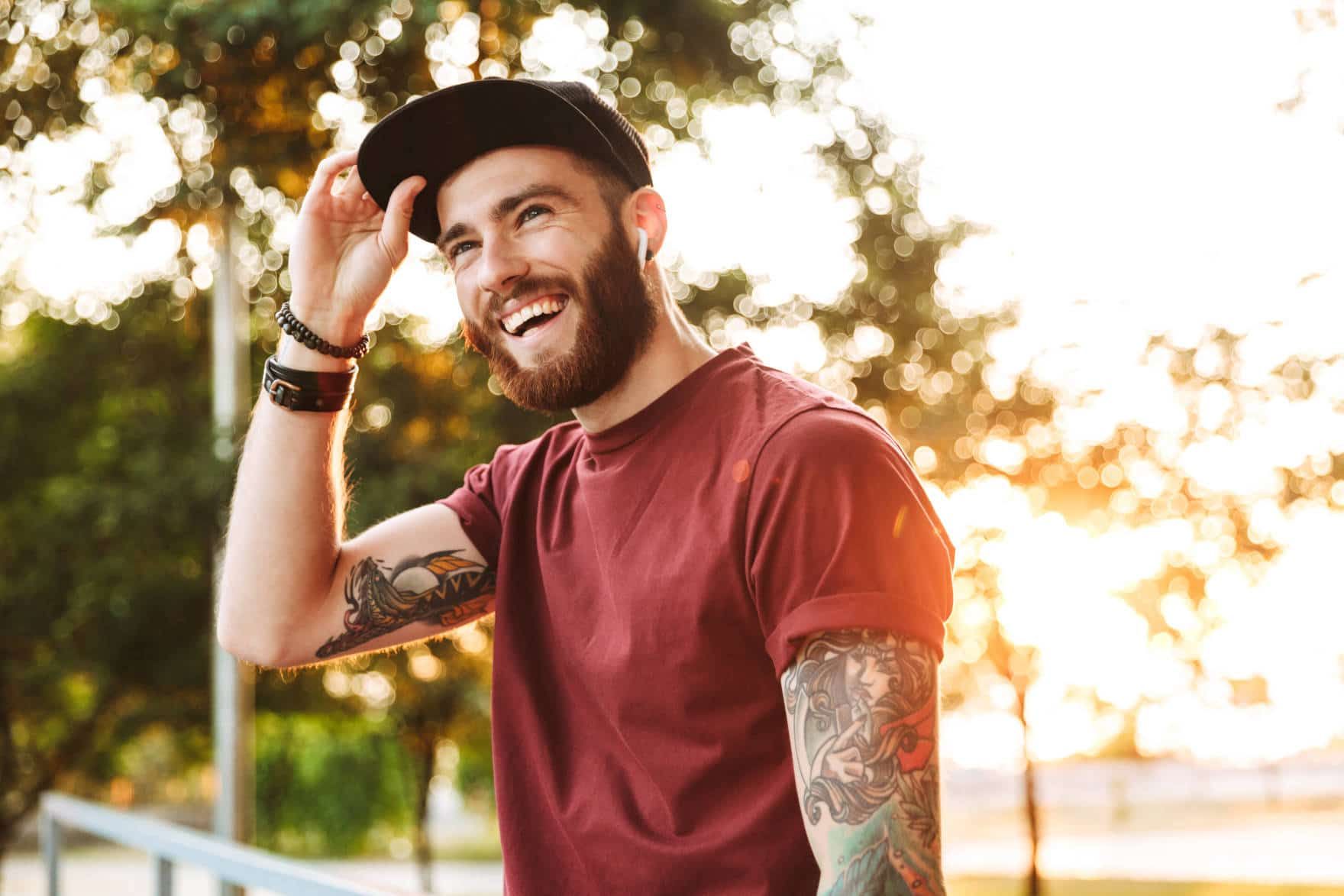 Smiling man outdoors Berkeley CA enjoys durable dental crowns