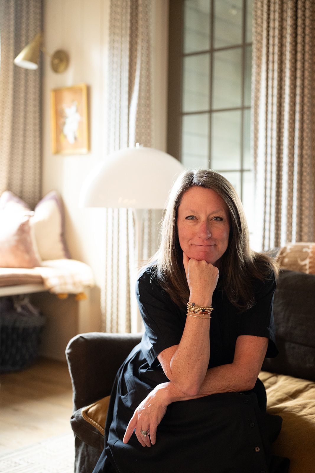 Mary Reed Durkin, founder of Mary Reed Durkin Real Estate, in a warmly lit portrait inside a Birmingham home.