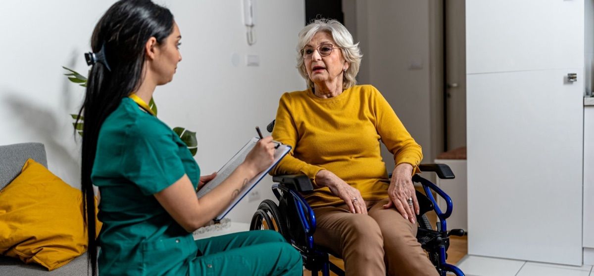 Personal support worker giving senior a free consultation and assessment