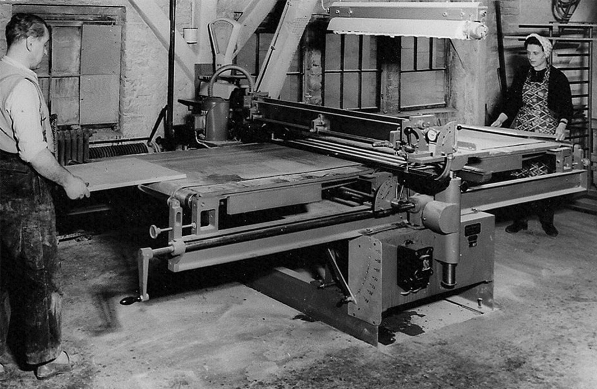 A man and a woman in the production factory circa 1940