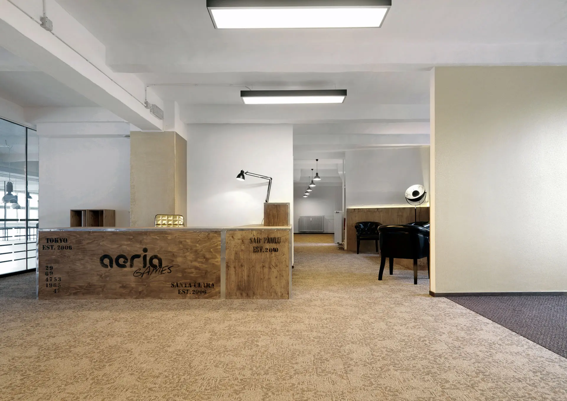 A photo of an office with wooden furniture and white walls