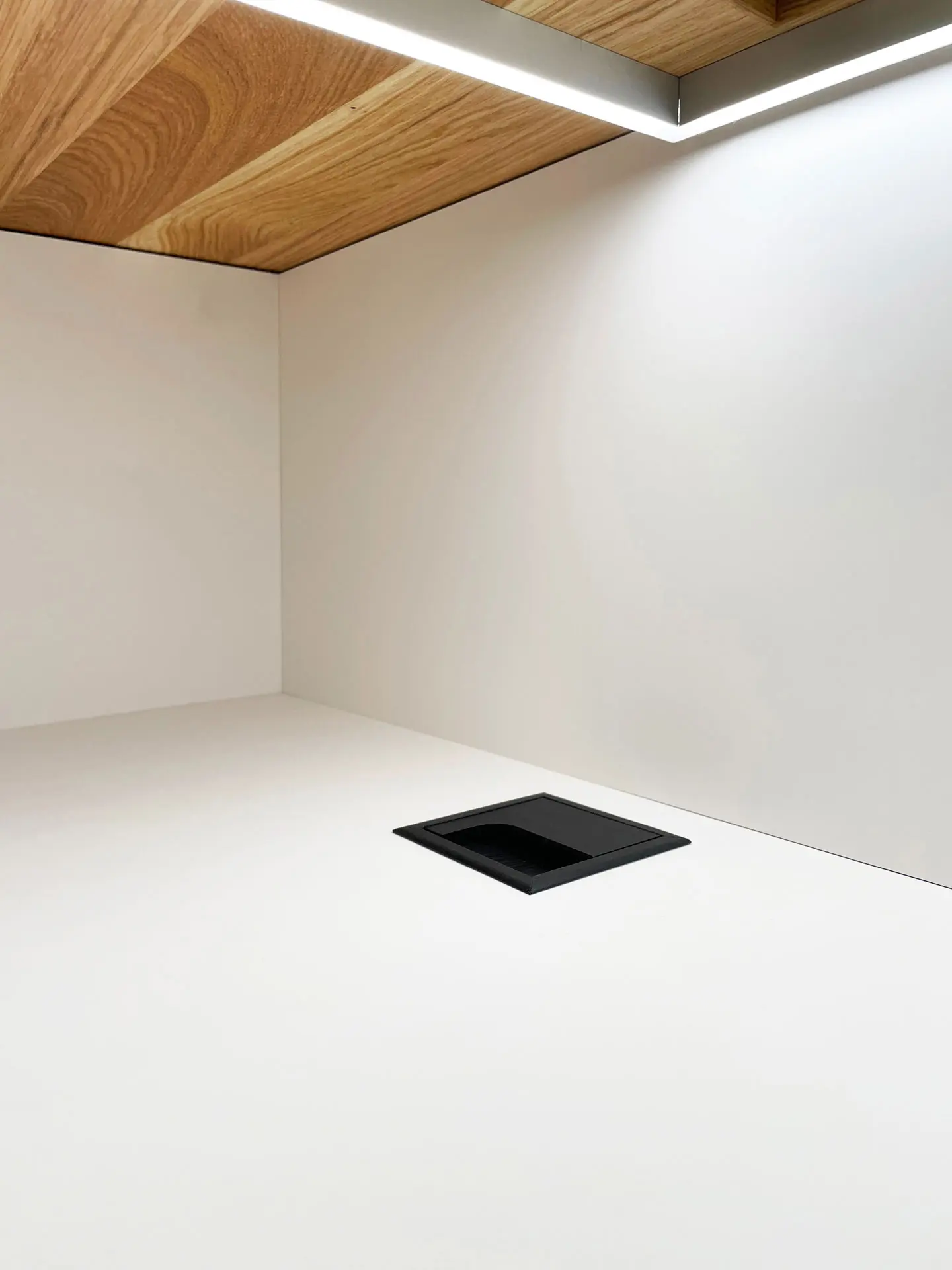 White table surface with power outlet and lighting