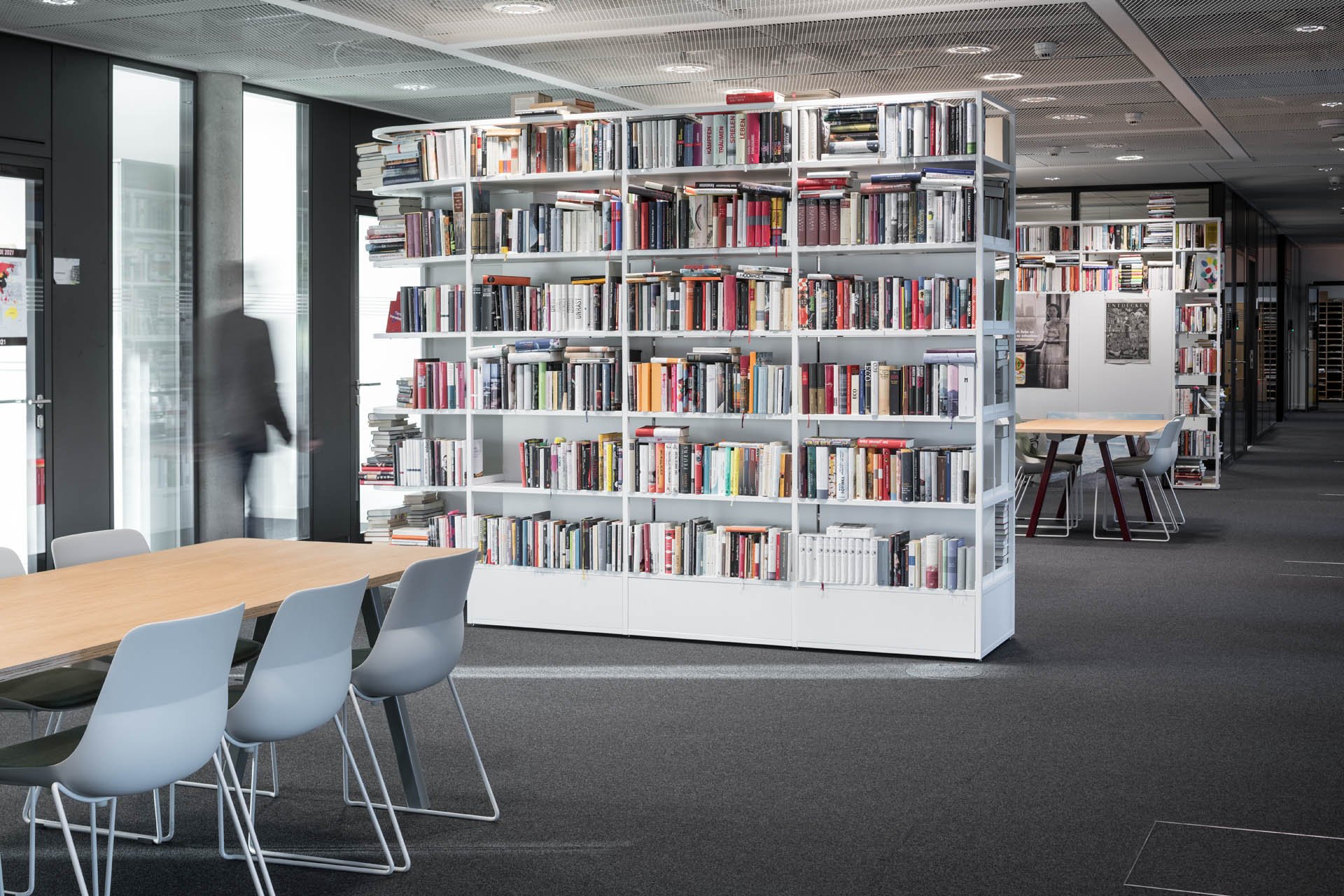 Office with large bookshelf in an editorial building