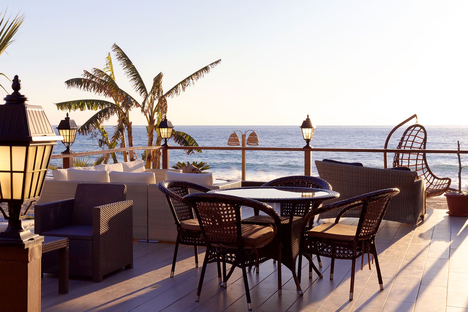 Tables set for dinner by the sea.