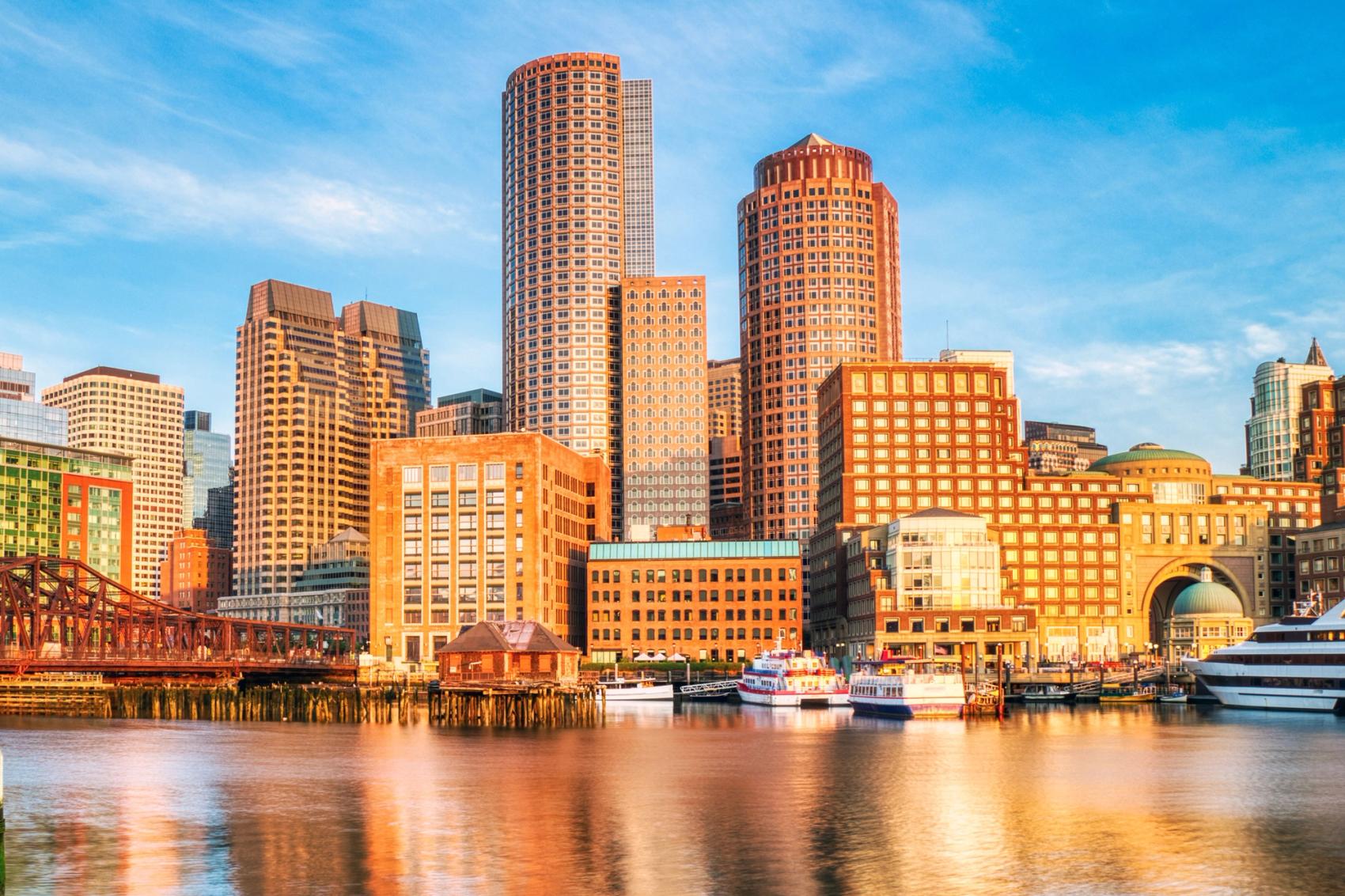 A view of a city skyline at sunset.