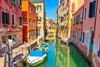Colourful houses by a Venetian canal.