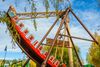 A pirate ship ride swinging in a theme park.