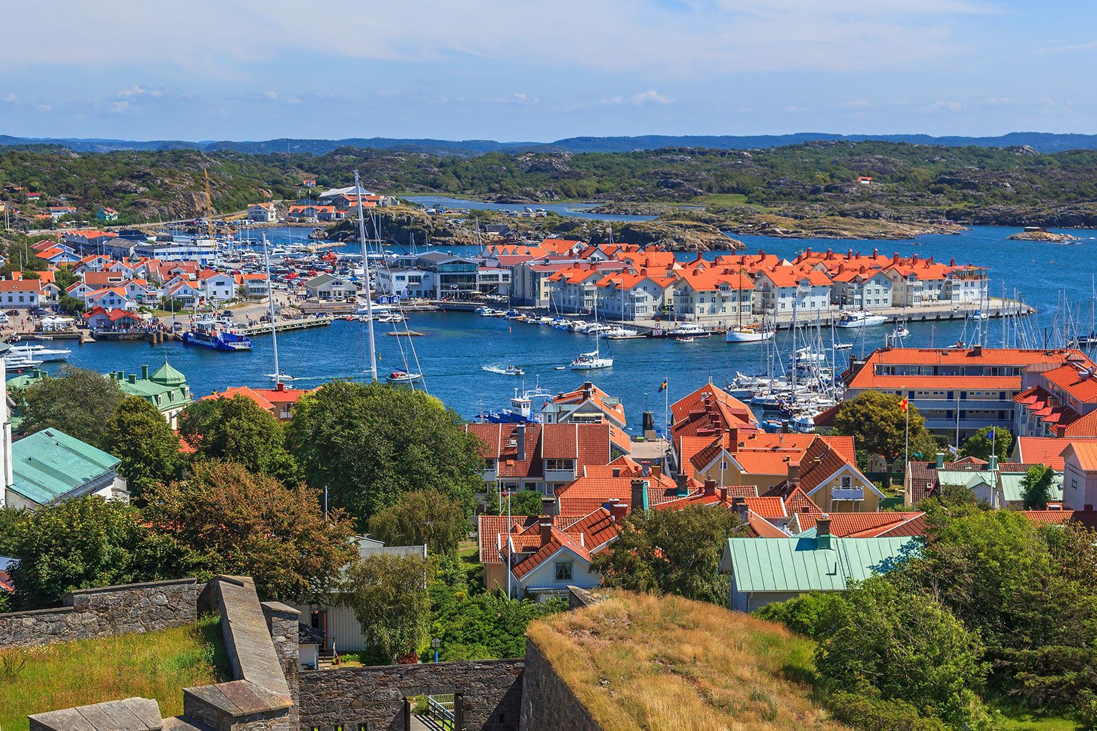 An aerial view of a coastal town with sea.