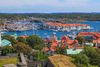 An aerial view of a coastal town with sea.