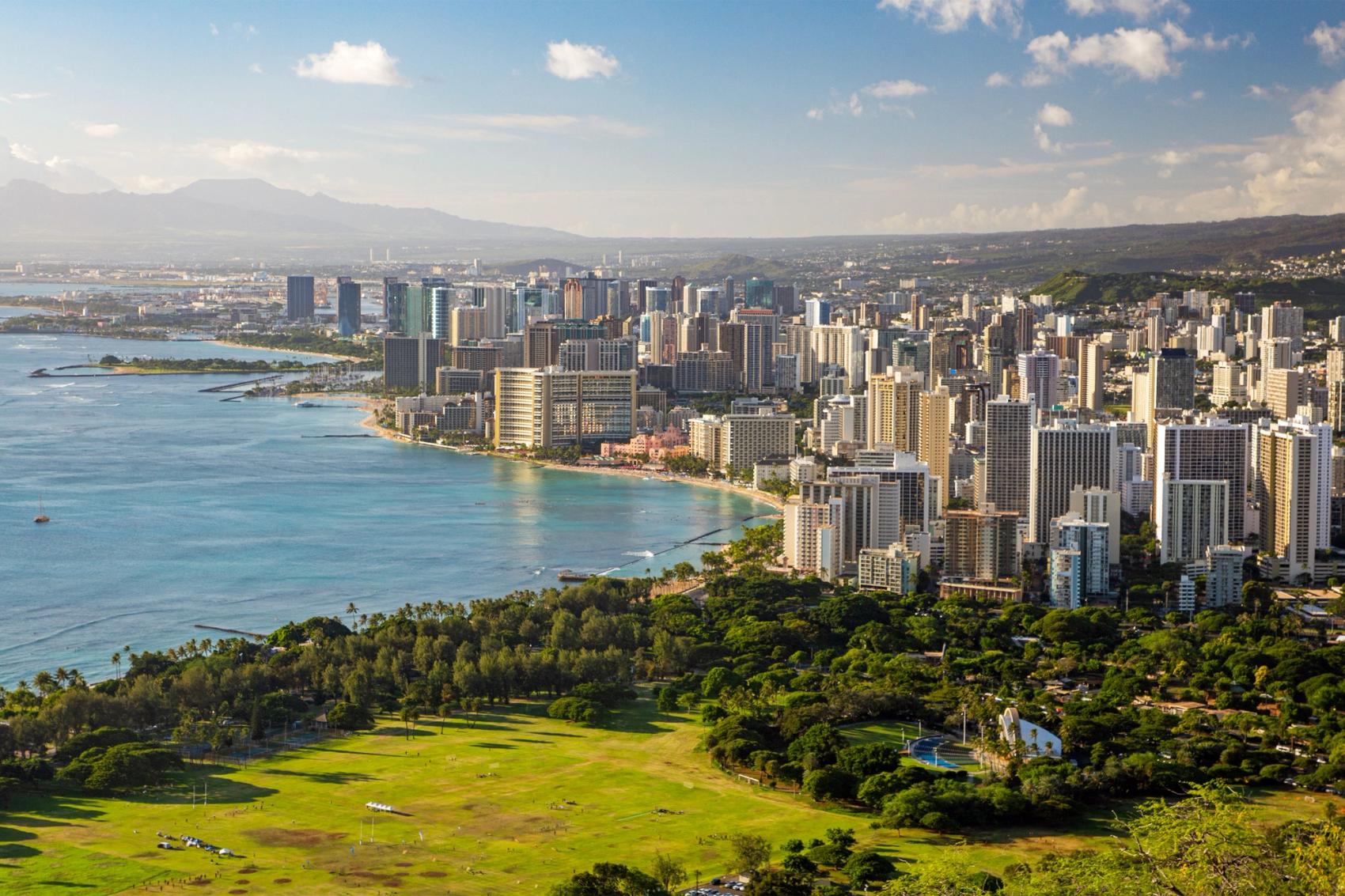 An aerial view of a city on a coastline.