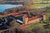 An above view of a castle hotel with nature grounds.