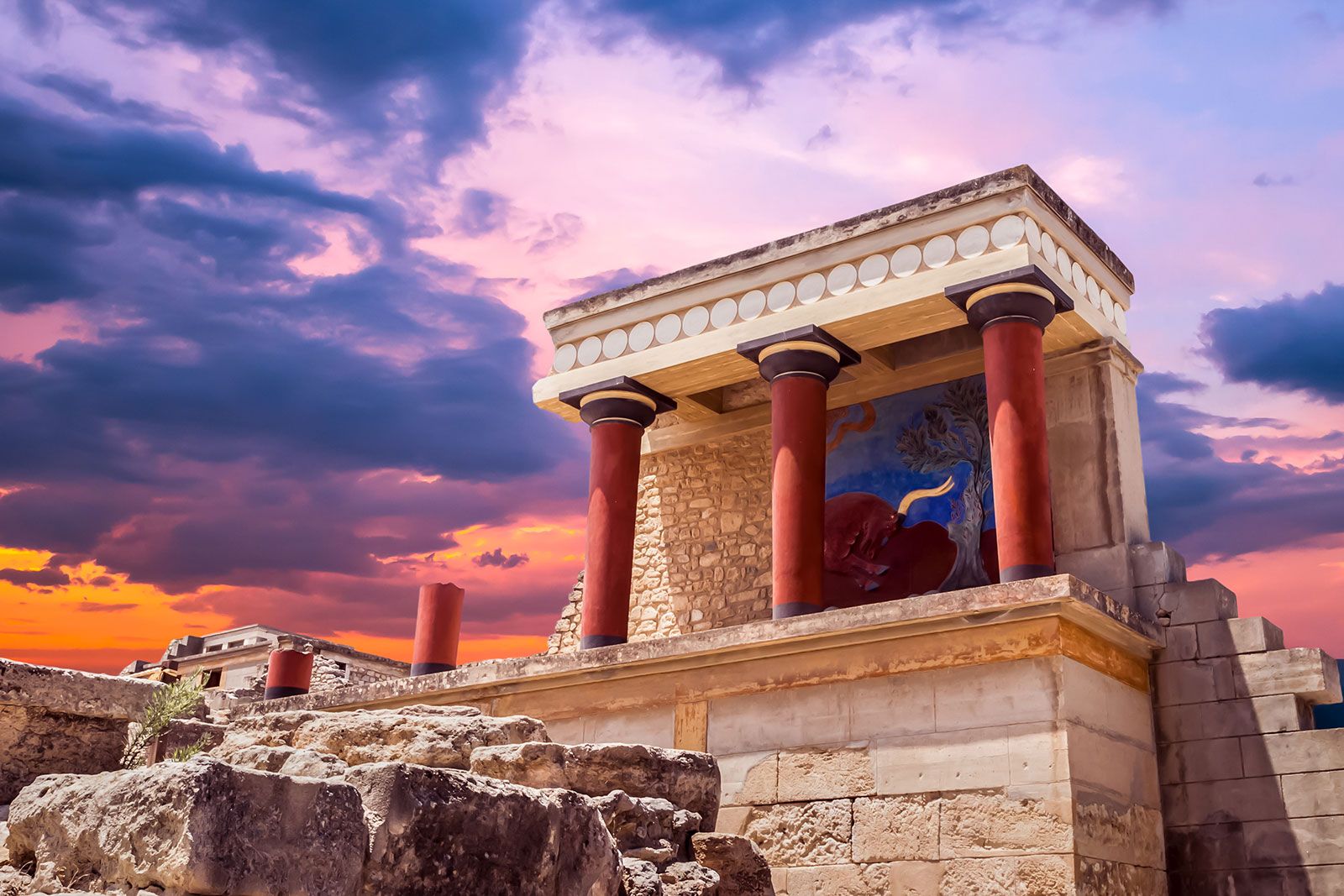 Ancient Greek temple at sunset.