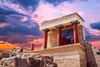 Ancient Greek temple at sunset.