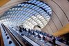The Canary Wharf station escalators and sculptural ceiling.