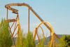 A yellow roller coaster ride track.