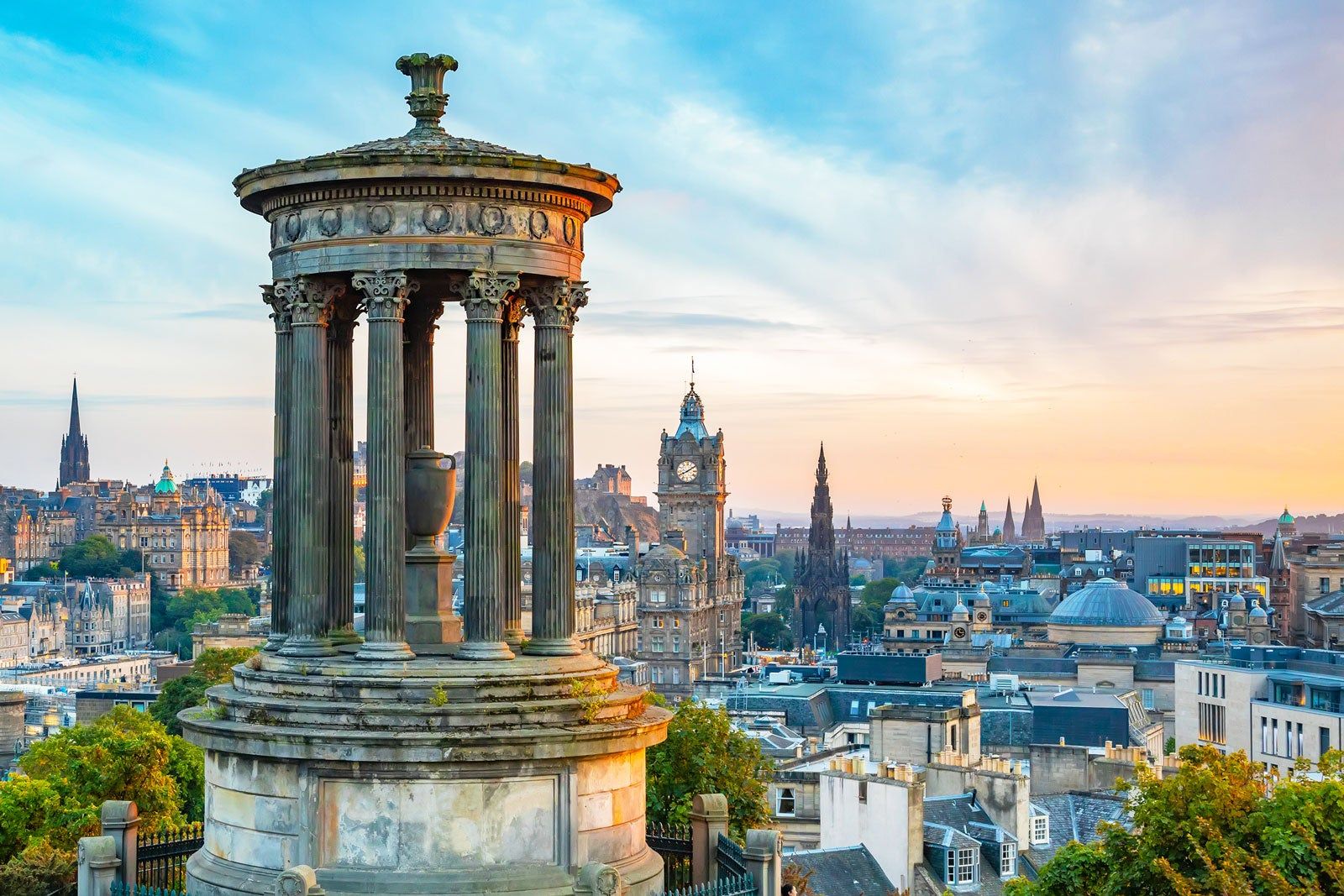 View of the city with a monument in the foreground.