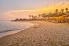 Wide beach at sunset.