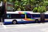 An Oahu bus on a street.