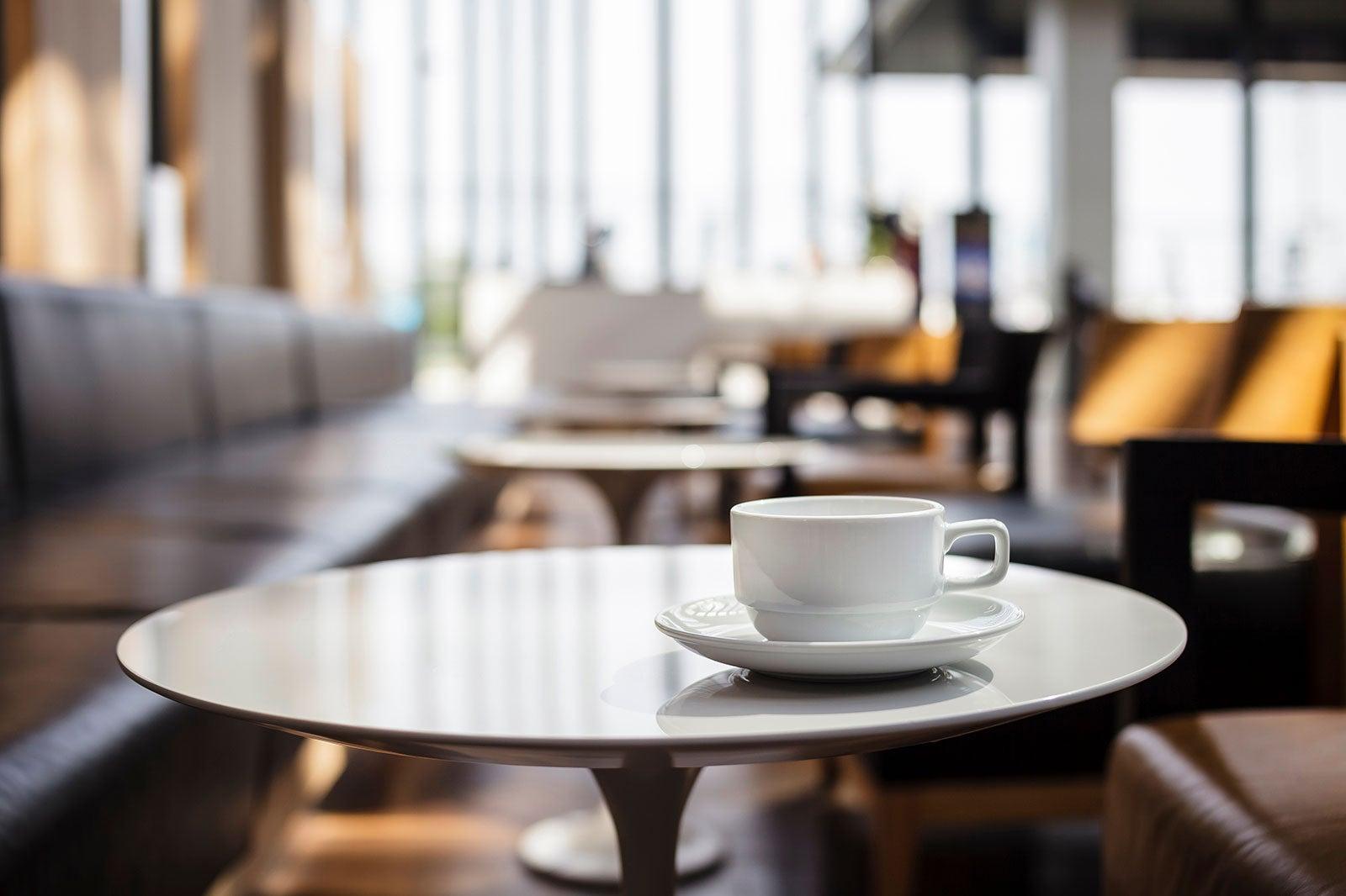 Cup of coffee on a table.