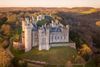 Huge elegant castle on a hill.