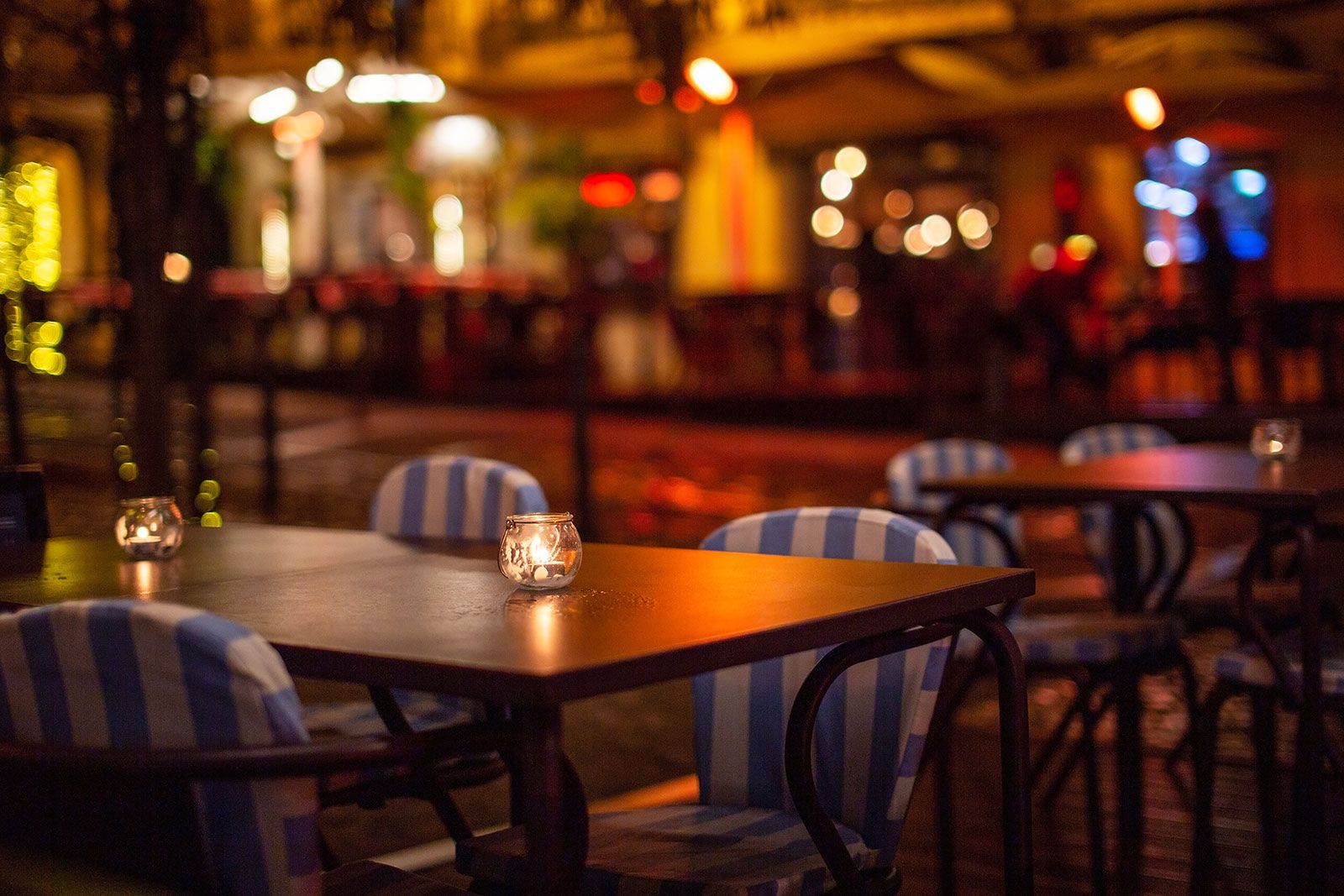 Outdoor tables with candles.
