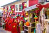 Ocean buoys hang outside a shop.
